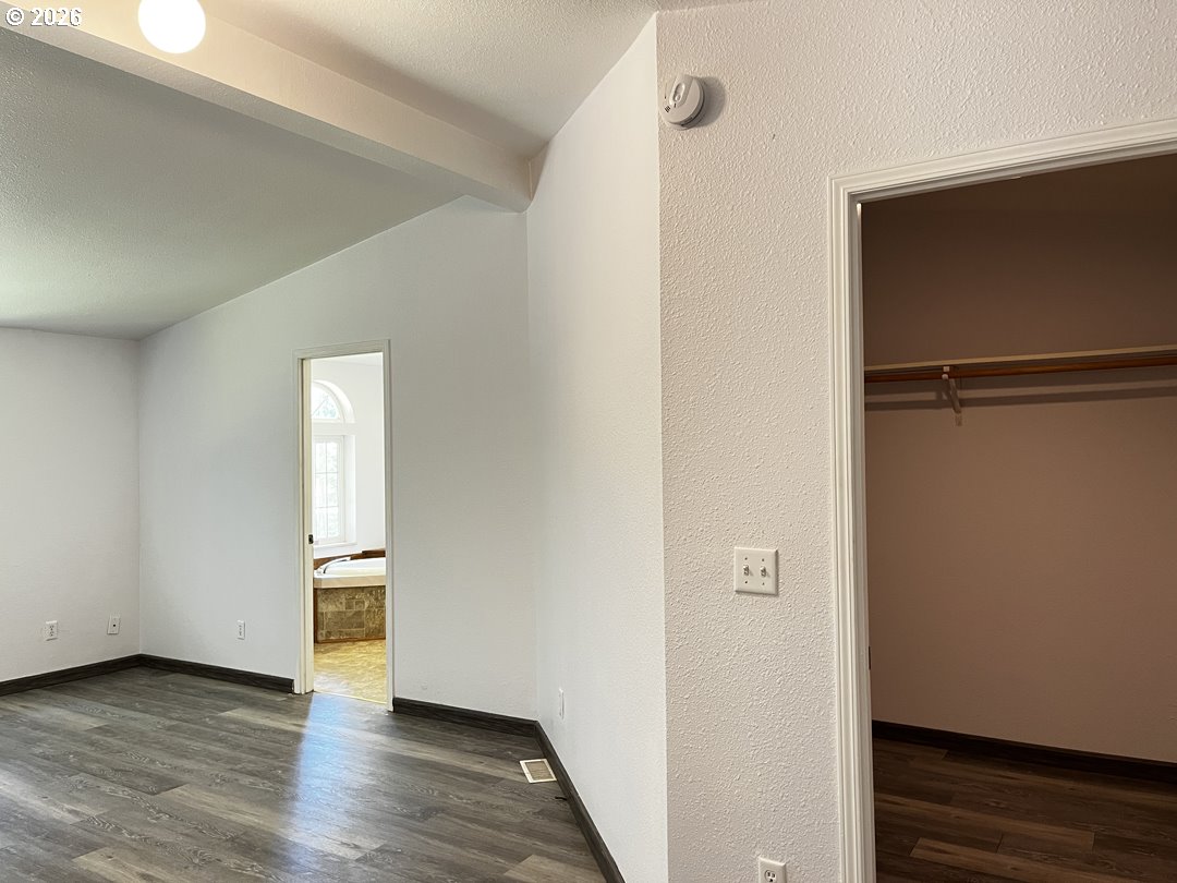 83411 Clear Lake Road Florence, OR 97439 - Photo 28 of 47 a view of an empty room and wooden floor