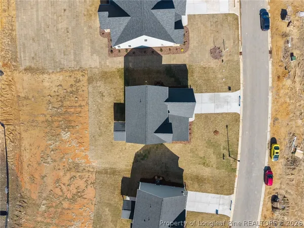 a bathroom with a double vanity sink toilet mirror and bathtub