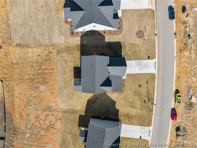 a bathroom with a double vanity sink toilet mirror and bathtub