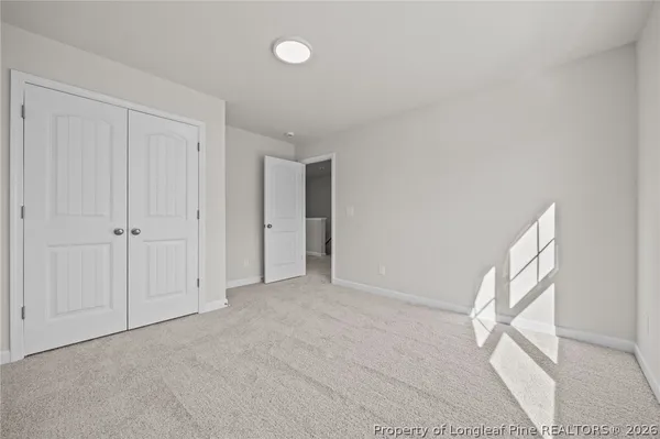 a bathroom with a double vanity sink mirror and shower