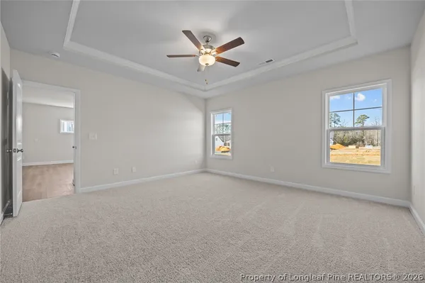 a living room with a fireplace and a window