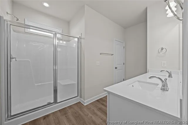 a kitchen with stainless steel appliances granite countertop a sink a refrigerator and a granite counter tops