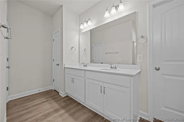 a kitchen with sink a stove and cabinets