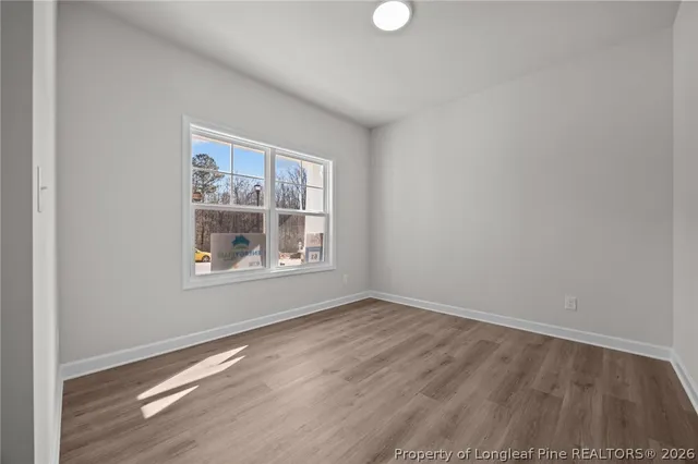a view of a house with snow on the road