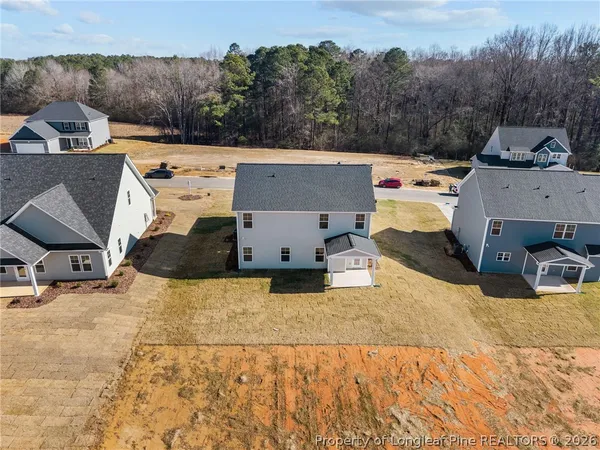 a view of a lake with couches and city view