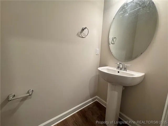 a bathroom with a sink and mirror