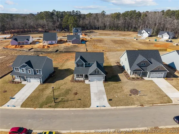 a bathroom with a sink a mirror and a shower