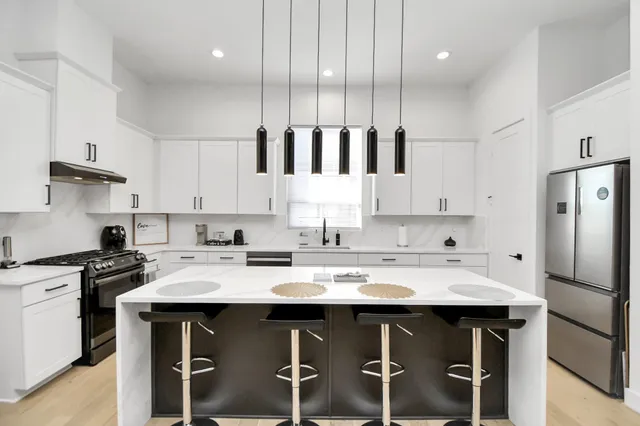 a kitchen with a sink and cabinets