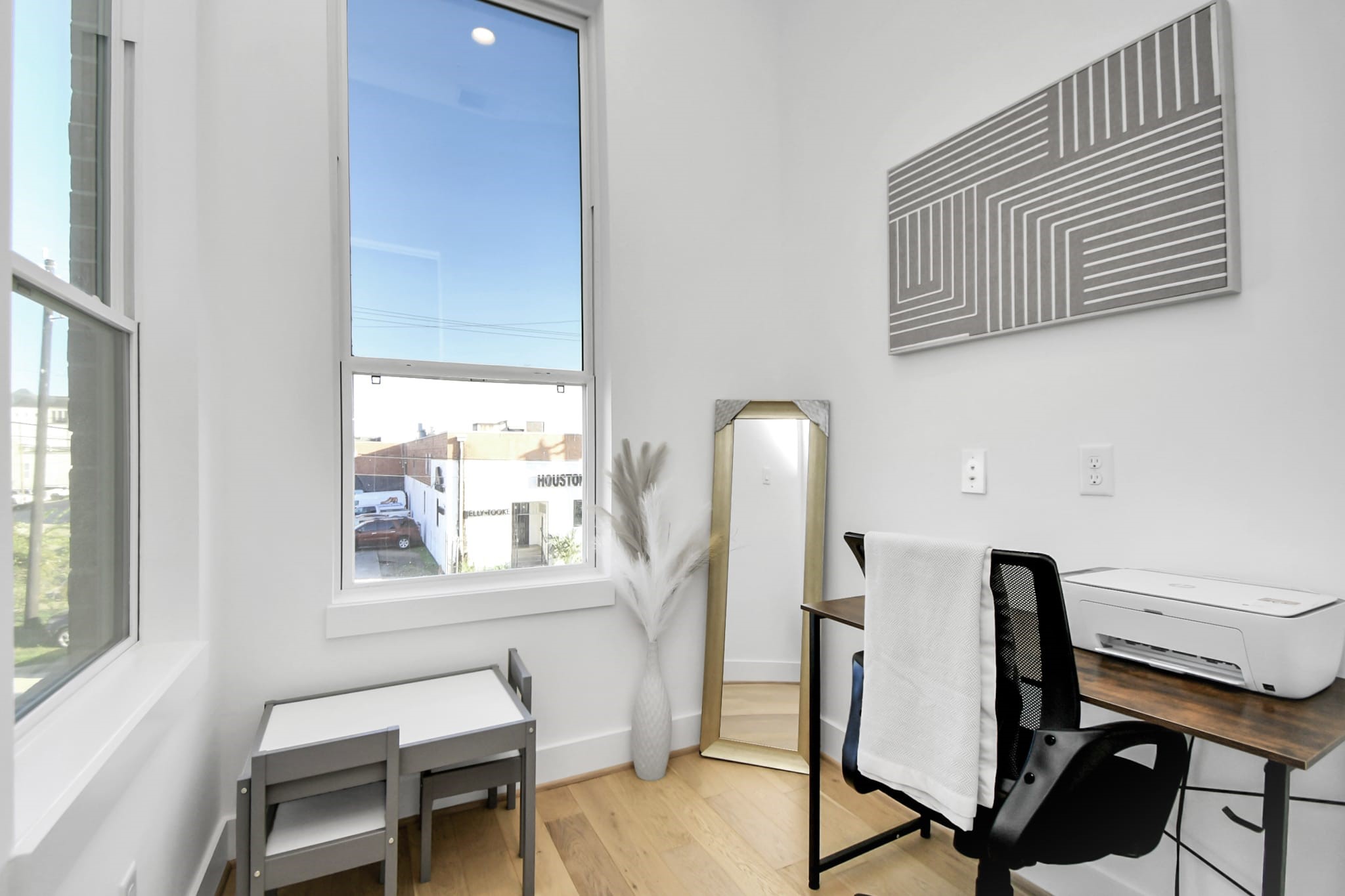 1104 Palmer Street Houston, TX 77003 - Photo 23 of 40 a view of a workspace with furniture and a window