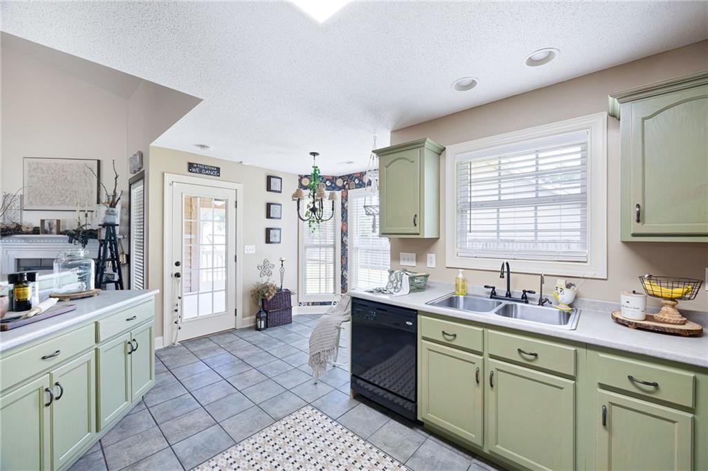 6 Keystone Lane Northeast Rome, GA 30161 - Photo 12 of 26 a kitchen with cabinets a sink and appliances