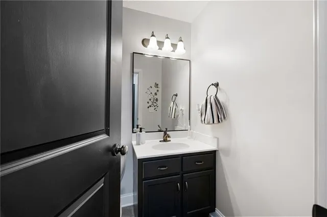 a bathroom with a toilet and a shower curtain
