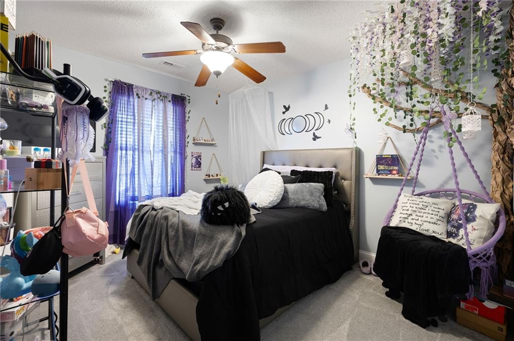 6 Keystone Lane Northeast Rome, GA 30161 - Photo 18 of 26 a bedroom with furniture and a fireplace