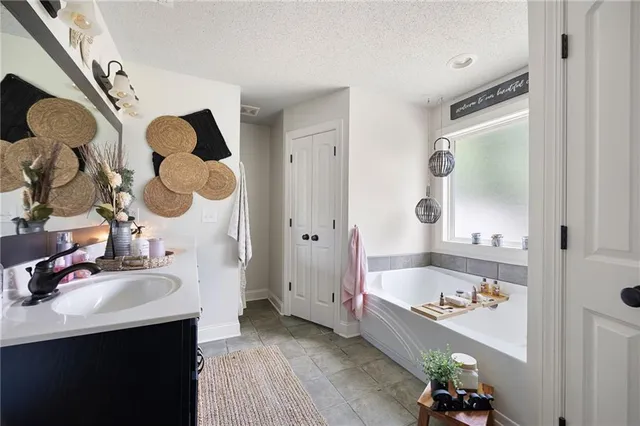 a bathroom with a sink vanity and a mirror