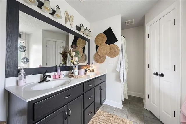 a bath tub sitting in a bathroom next to a window