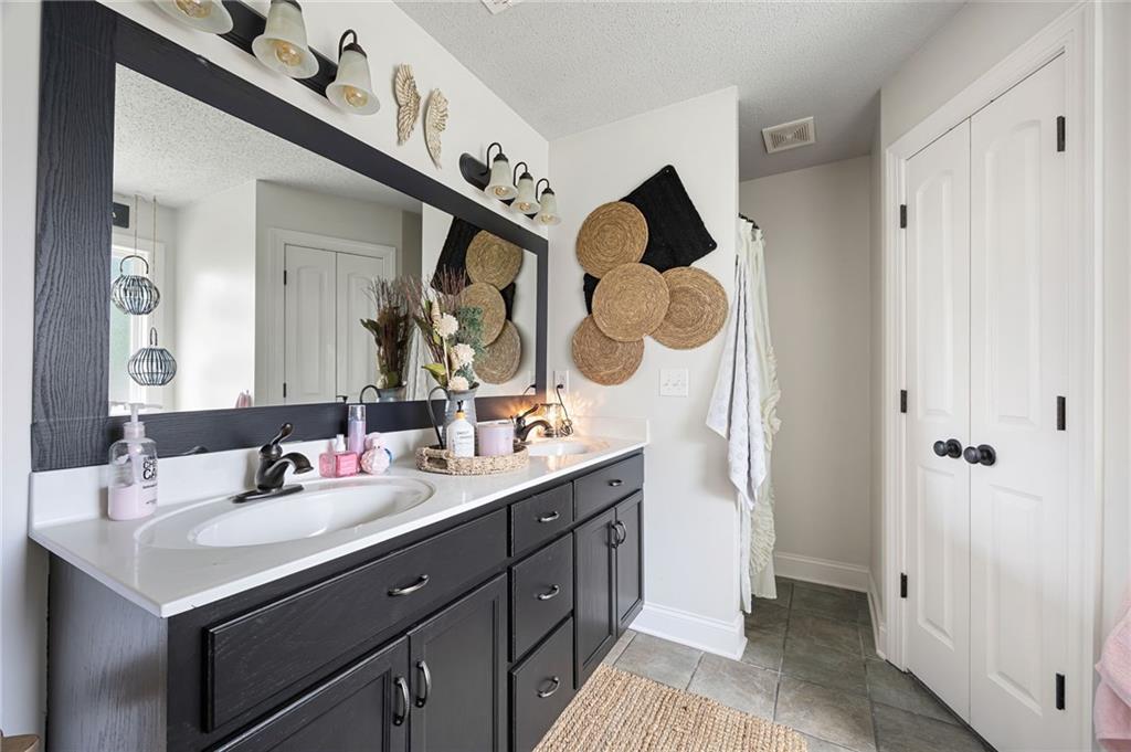 6 Keystone Lane Northeast Rome, GA 30161 - Photo 22 of 26 a bathroom with a sink vanity and a mirror