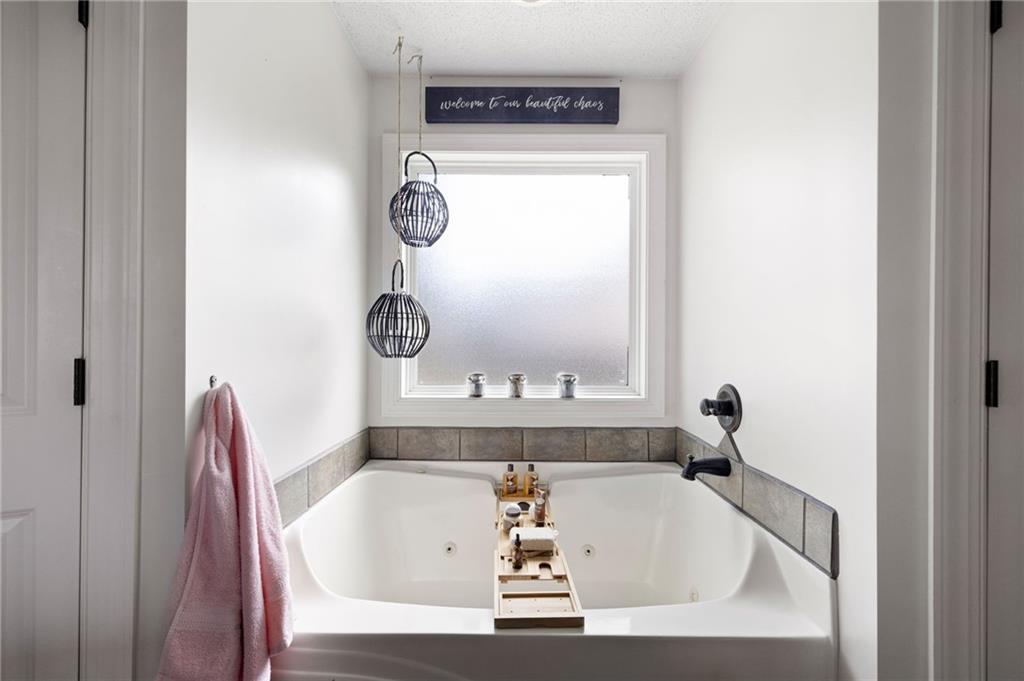 6 Keystone Lane Northeast Rome, GA 30161 - Photo 23 of 26 a bath tub sitting in a bathroom next to a window