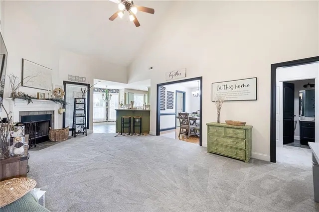 a view of a livingroom with furniture and a flat screen tv