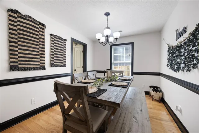 a kitchen with a sink cabinets and wooden floor