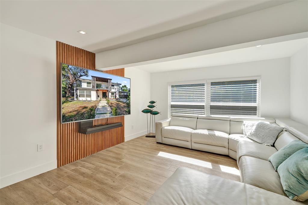 701 Northeast 164th Street Miami, FL 33162 - Photo 11 of 52 a bedroom with furniture and a window