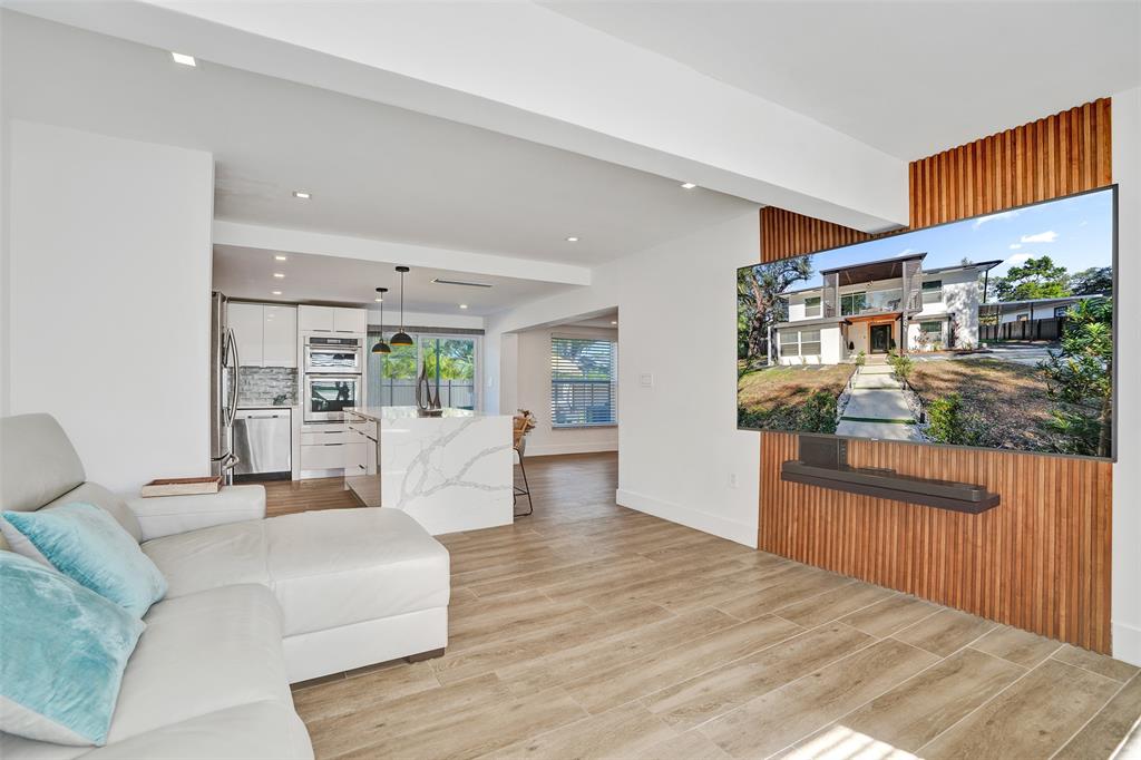 701 Northeast 164th Street Miami, FL 33162 - Photo 13 of 52 a living room with furniture and a wooden floor