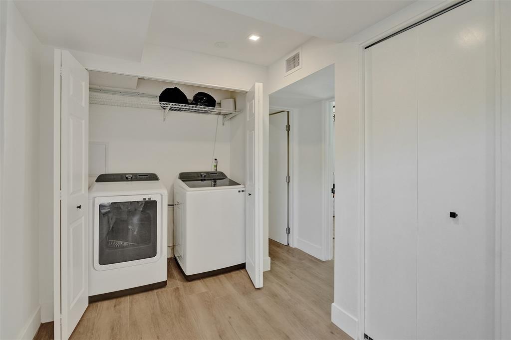 701 Northeast 164th Street Miami, FL 33162 - Photo 15 of 52 a view of kitchen with refrigerator and white cabinets