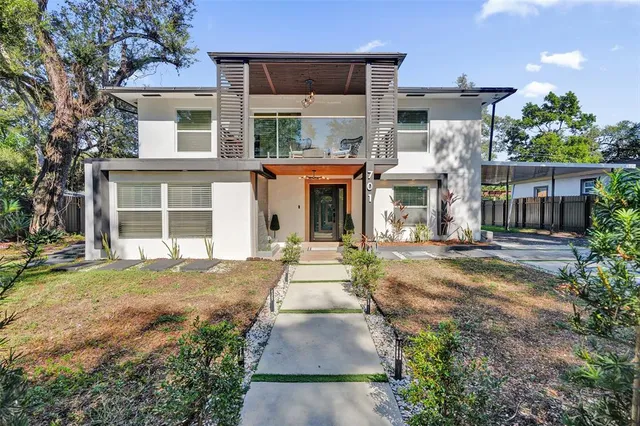 front view of a house with a yard