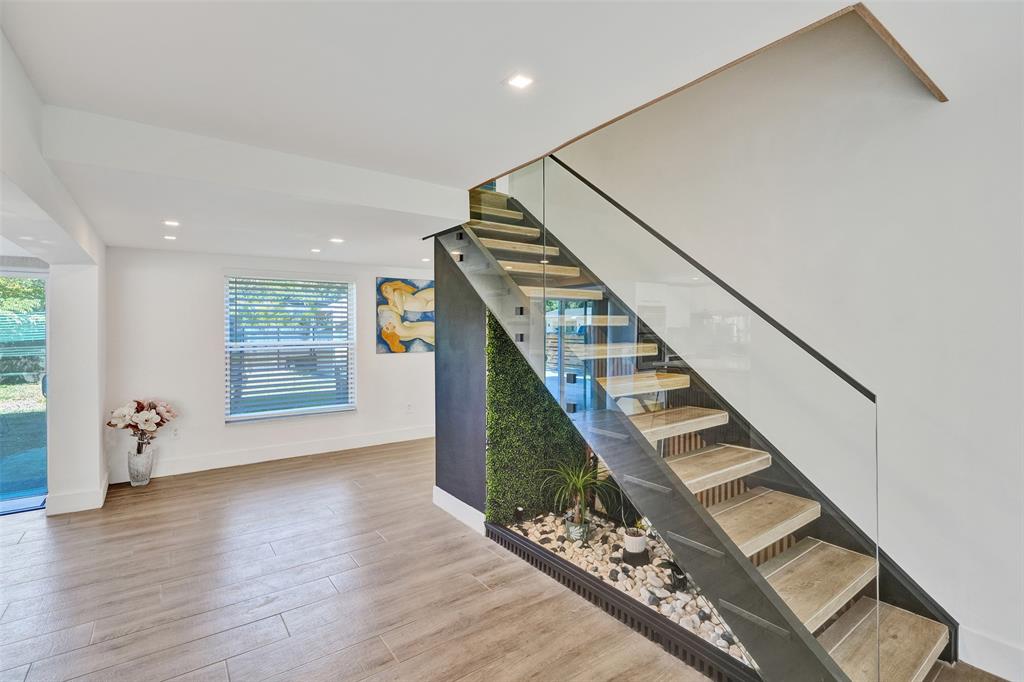 701 Northeast 164th Street Miami, FL 33162 - Photo 4 of 52 a view of entryway and hall with wooden floor