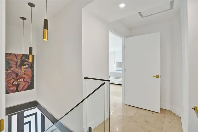 a view of a house with a yard and large tree