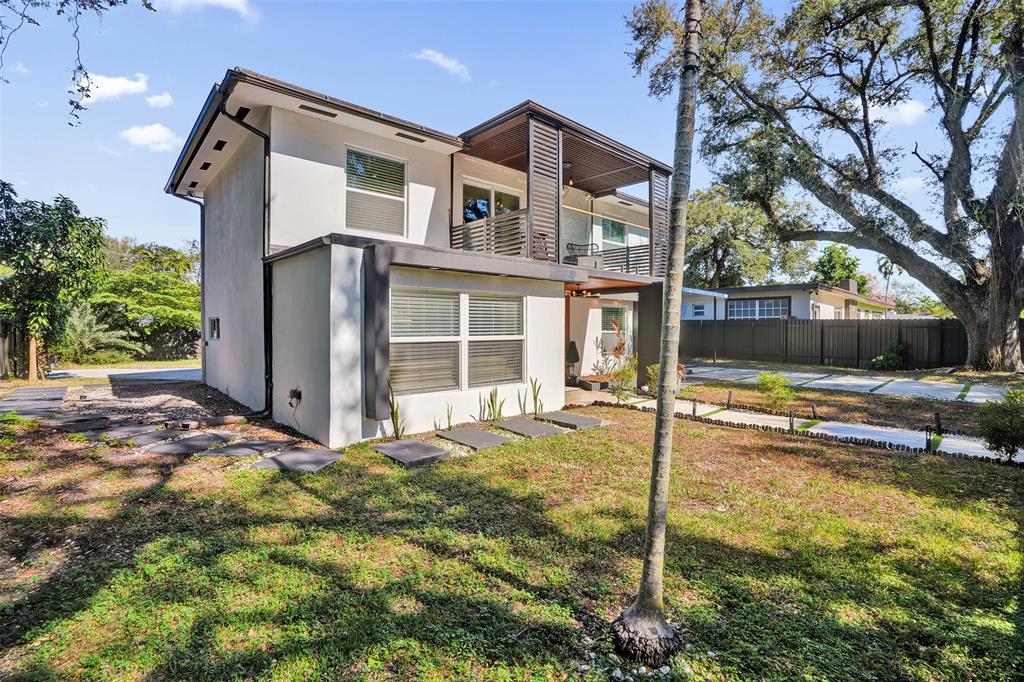 701 Northeast 164th Street Miami, FL 33162 - Photo 43 of 52 a front view of a house with a yard