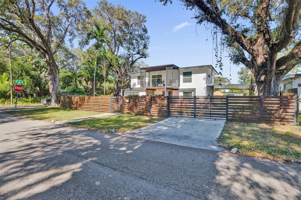 701 Northeast 164th Street Miami, FL 33162 - Photo 51 of 52 a front view of a house with a yard