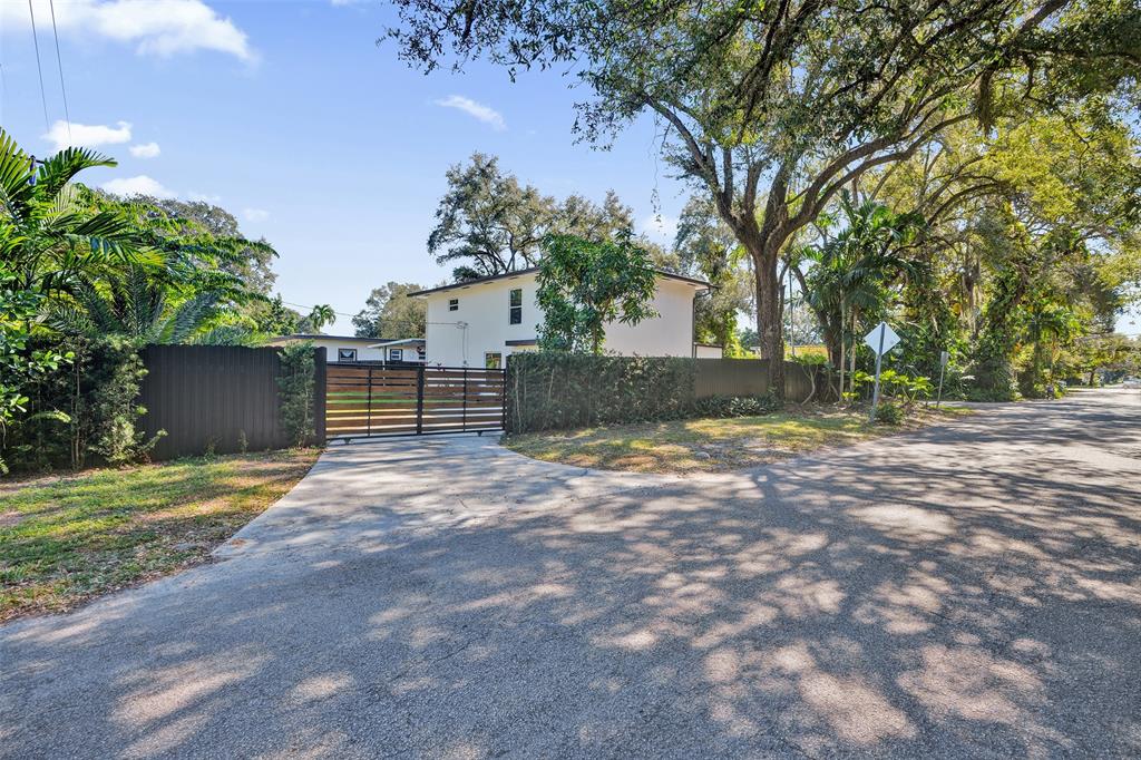 701 Northeast 164th Street Miami, FL 33162 - Photo 52 of 52 a view of a backyard with large trees