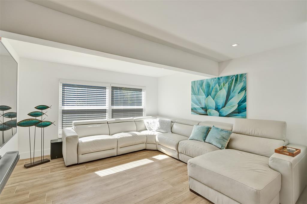 701 Northeast 164th Street Miami, FL 33162 - Photo 10 of 52 a living room with furniture and a large window