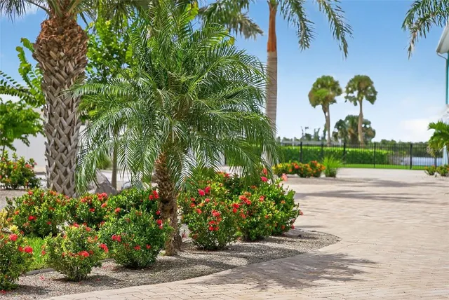 a dining table with wooden floor and stainless steel appliances