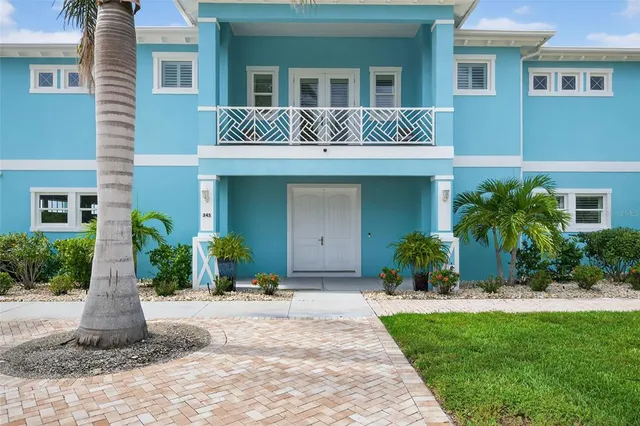 a kitchen with white cabinets and appliances