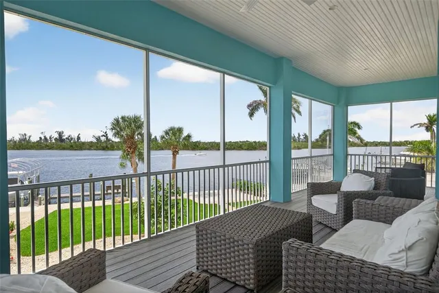 a kitchen with kitchen island granite countertop a sink a counter space stainless steel appliances and cabinets