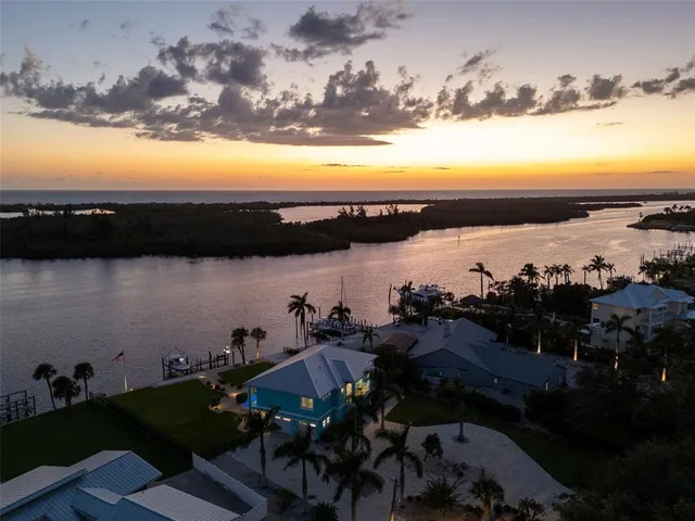 an aerial view of a house with a lake view