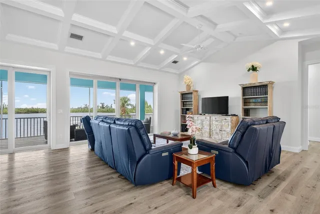 a view of a balcony with a floor to ceiling window stairs and a ocean view
