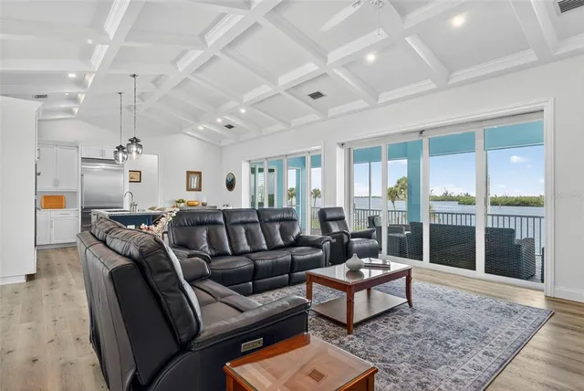 a view of a balcony with couch and wooden floor