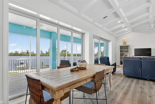 a bathroom with a granite countertop sink a mirror and a potted plant