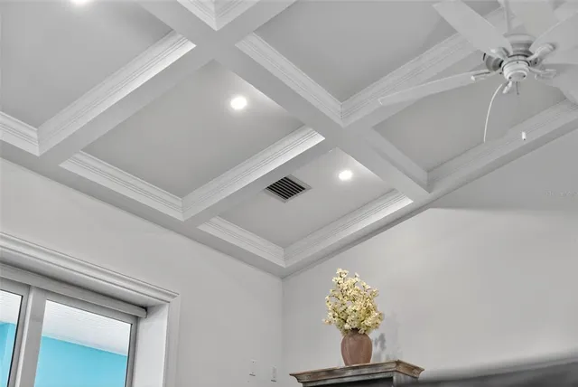 a view of a sink a mirror and cabinets in a room