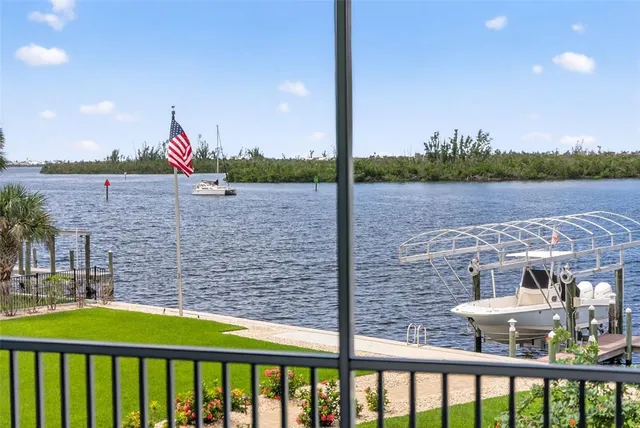 a view of a house with backyard sitting area and garden