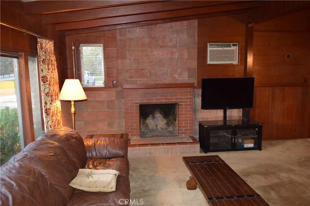 41329 Gibbel Road Hemet, CA 92544 - Photo 15 of 30 a living room with furniture and a fireplace