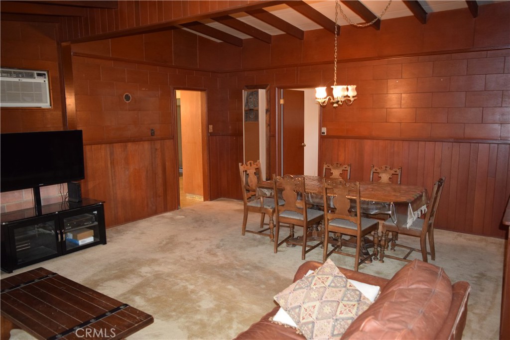 41329 Gibbel Road Hemet, CA 92544 - Photo 16 of 30 a living room with furniture a window and a flat screen tv