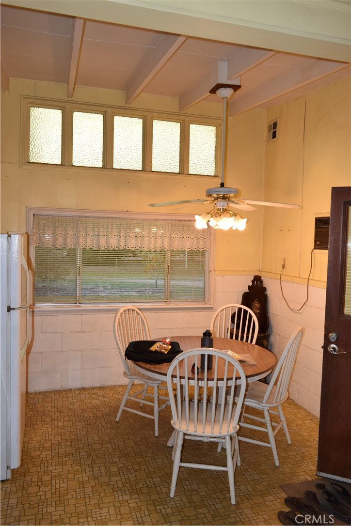 41329 Gibbel Road Hemet, CA 92544 - Photo 21 of 30 a dining room with furniture and a window