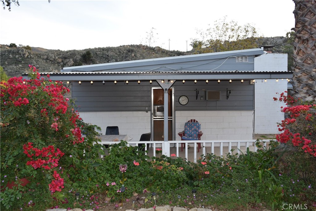 41329 Gibbel Road Hemet, CA 92544 - Photo 8 of 30 a front view of a house with a yard and potted plants