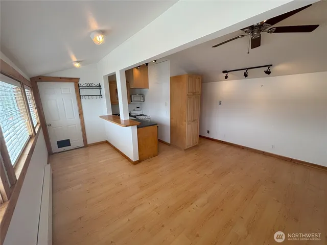 a view of an empty room with a window