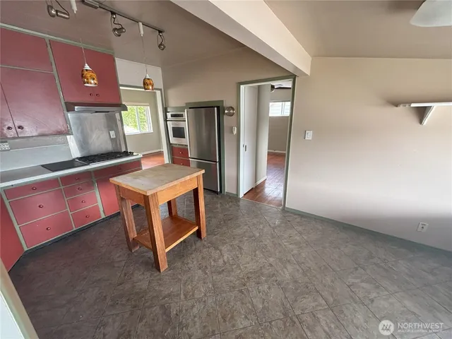 a room with pool table and flat screen tv