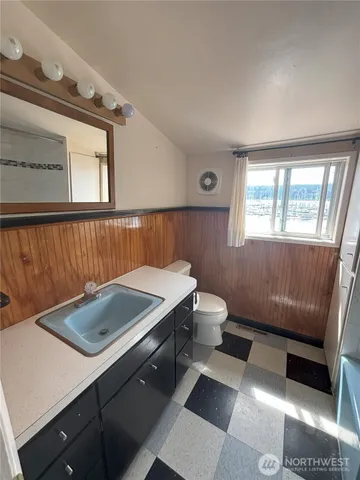 a room with a couch and a window