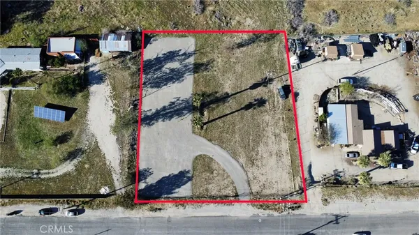 an aerial view of a house with outdoor space