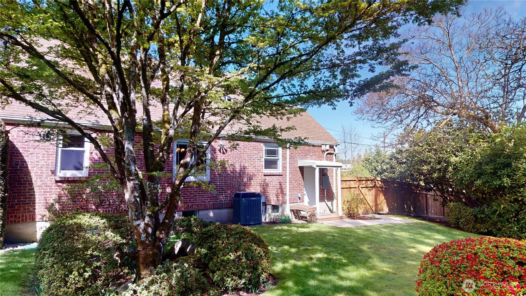 1533 Northeast Tagholm Road Poulsbo, WA 98370 - Photo 32 of 40 a view of a house with a yard